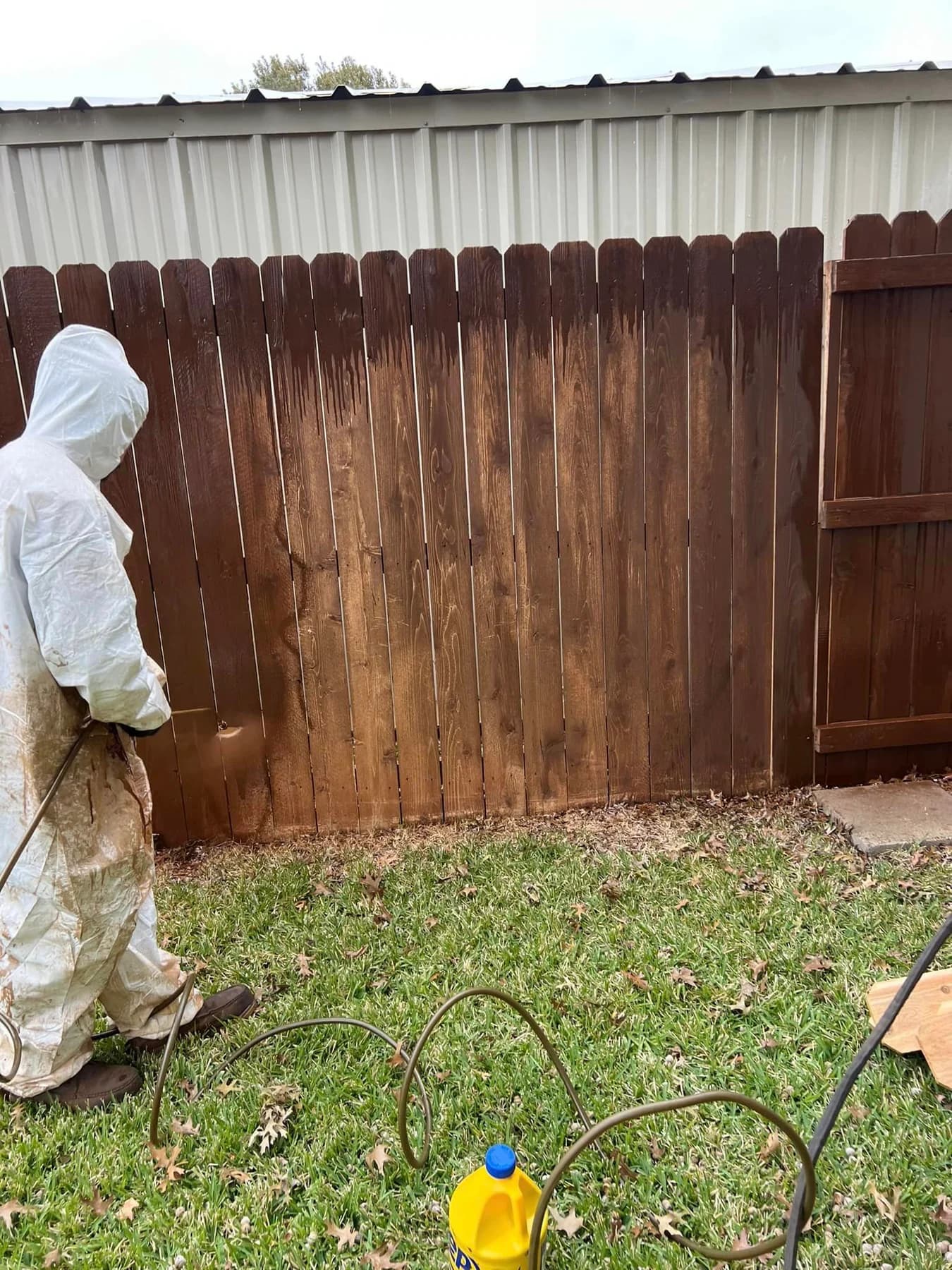 Wood fence featured in Fortress Fencing’s cleaning work