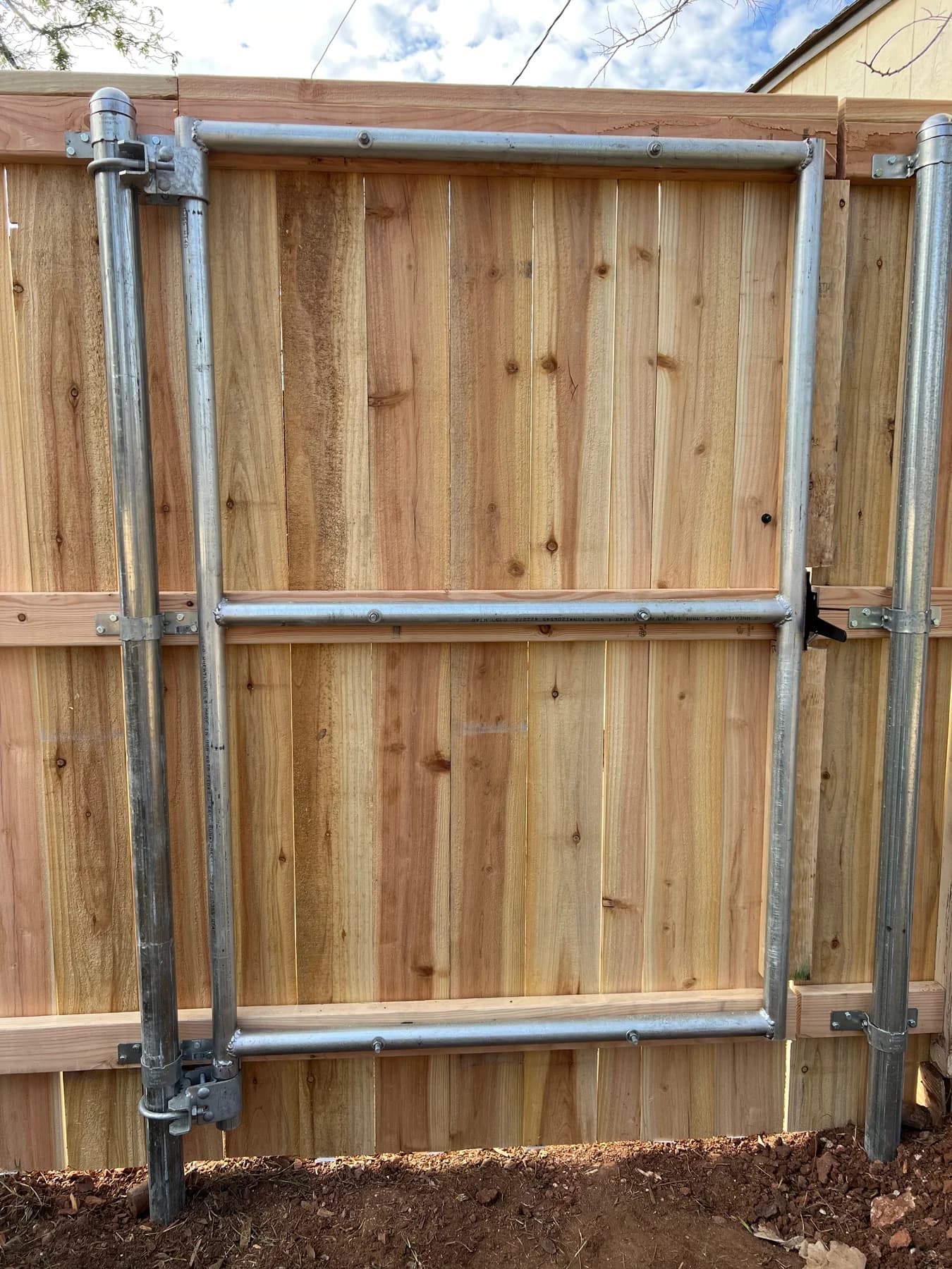 Custom gate from the Fortress Fencing metal-framed gate portfolio