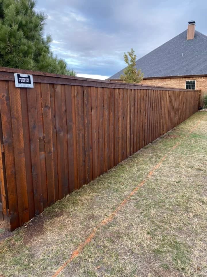 Finished wood fence from the Fortress Fencing staining portfolio